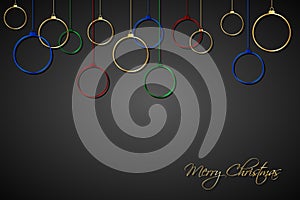 Red, blue, green and gold christmas balls with strings on black background. Holiday greeting card with merry christmas sign