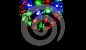 Red, blue and green light on dark background for Christmas concept