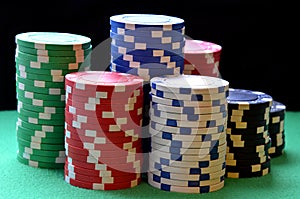 Red, blue, green, white and black poker chips