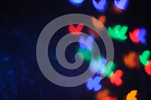 Red, blue, green, yellow bokeh on dark background, stock photo