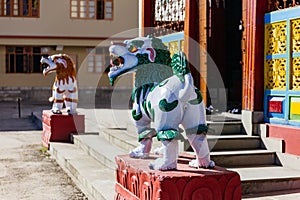 Red and blue kirins in front of Tibetan Buddhism Temple entrance in Sikkim, India