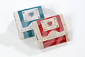 Red and blue leather wallets with hearts