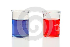 Red and blue liquid in beakers