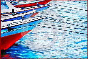 Red and blue old boats in the seaport. Colored reflections in the water. Sea background