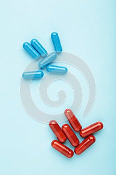 Red and Blue pills on blue background. Choice concept