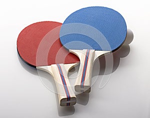 Red and Blue Ping Pong Paddles - Handles Facing Camera, Ball on