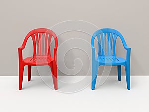 Red and blue plastic chairs side by side