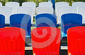 Red and blue stadium seats close up