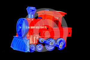 A red and blue toy train with a blue engine