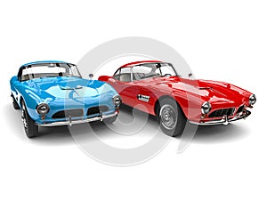 Red and blue vintage race cars - side by side