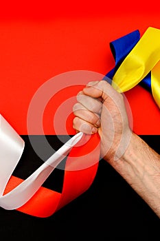 Red blue white yellow black conflict between Ukraine Poland two flag top view hand right sector confrontation