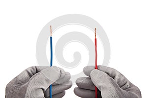 Red and Blue Wires in Hands with Gloves