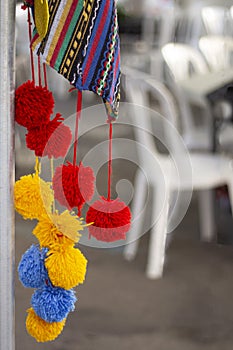 Red, blue, yellow buboes from threads. Holiday Spain Hogueras photo