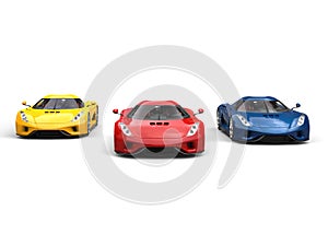 Red, blue and yellow super cars racing - front view