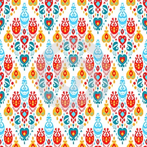 Red blue yellow and white colorful ikat asian traditional fabric seamless pattern, vector