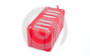 Red Bluetooth speaker on white