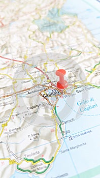 A red board pin stuck in Cagliari Sardinia Italy portrait