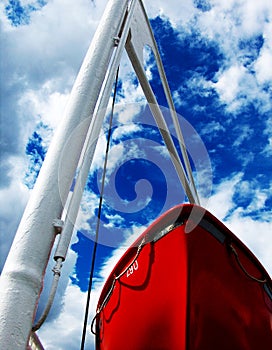 Red boat and blue sky