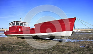 Red boat at low tide in Lege Cap Ferret photo