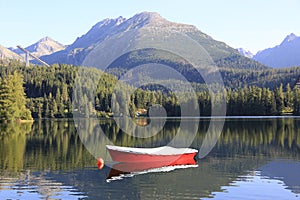 Red boat on lake