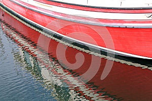 Red boat reflection