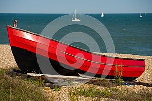 Red boat resting in the sunshine