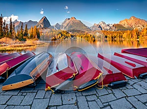 Red boats on the shore of Strbske pleso lake