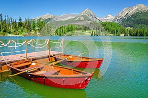 Red boats and Tatra Mountains high peaks, Slovakia