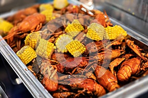 Red boiled crawfish and corn