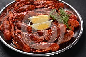 Red boiled crawfishes on table in rustic style.