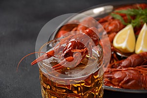 Red boiled crawfishes on table in rustic style.