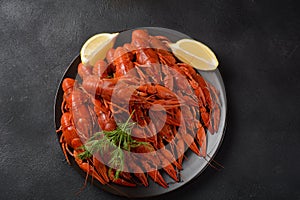 Red boiled crawfishes on table in rustic style.