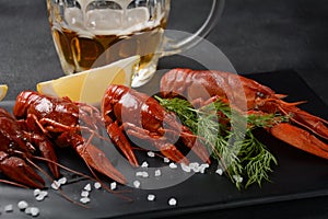 Red boiled crawfishes on table in rustic style.