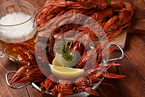 Red boiled crawfishes on table in rustic style.