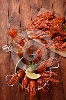 Red boiled crawfishes on table in rustic style.