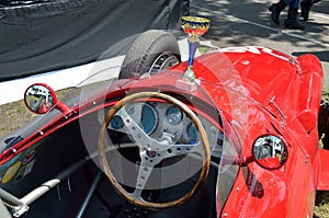 Red bolide racing car with a goblet