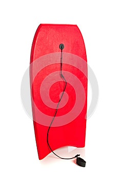 Red boogie board on white