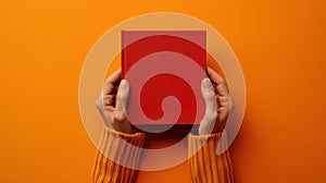 The red book on orange.AI generated image
