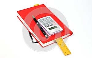 Red book,pen,calculator and ruler