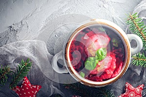 Red borscht dumplings Christmas table place text