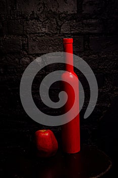 Red bottle and red apple o