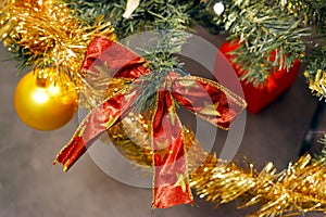 Red bow and Christmas balls on fir