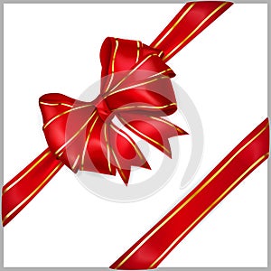 Red bow with diagonally ribbons with golden strips photo
