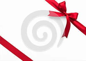 Red bow satin ribbon band stripe fabric on corner isolated on white background with clipping path for Christmas holiday gift box