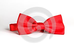 Red bow tie isolated on white background