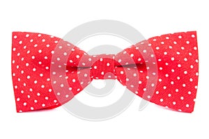 Red bow tie with polka dots isolated