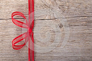 A red bow on wood photo