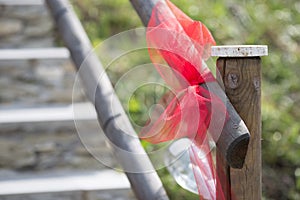 Red bow on wooden fance photo
