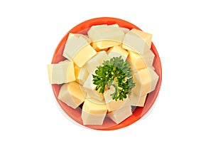 Red bowl with mozzarella cheese and parsley, white background