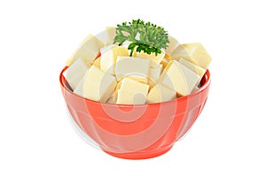 Red bowl with mozzarella cheese and parsley, white background